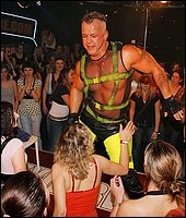 Muscular strippers seducing hot drunken girls at wild party